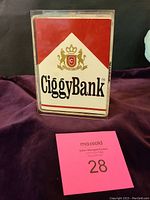 Front view of the rectangular Ciggy Bank showing the red and white label with logo and text.