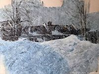 Close-up photo showing detailed texture of the watercolor depicting snow and houses in winter.