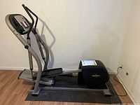 Side view of the NordicTrack CXT 1055 elliptical trainer showing overall size, design, and presence of digital console and handles.