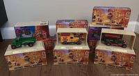 Full view of the collection showing several boxed Matchbox Models of Yesteryear trucks with beer branding in original packaging.