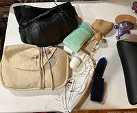 Overview of various neck and back support items including pillows, braces, and massagers arranged on a flat surface.