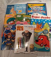 Top view of all books showing the variety including Crayola, Despicable Me 3, Clifford, and others.