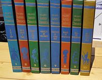 Front spines view of 8 Collier's Junior Classics books in various colors and titles.