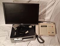 HP dx5150 SFF computer with optical drive, Dell 20-inch monitor behind, VGA cables visible, Brother MFC-390MC fax machine to side