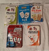 Overview of five different educational flash card decks with colorful packaging.