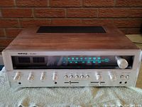 Full front view of Nikko 9095 receiver showing wood cabinet and aluminum faceplate