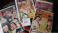 Group of Silver Age DC Comics romance issues showing different titles such as Young Love and Girls' Romances with covers of dramatic romantic scenes