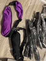 10 new money belts including black and purple colors, some unpackaged and some still in plastic bags.