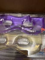 Package showing purple and gold gel eye masks labeled Heat in a Click.