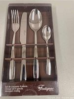 Full view of Fontignac 4-piece stainless steel cutlery set in original box showing fork, knife, tablespoon, and teaspoon.
