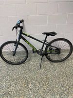 Side view of the Norco youth bike showing the entire frame, wheels, seat and handlebar.