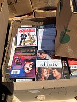 View of DVDs on top showing movie titles including 'Working Girl' and 'The Holiday'