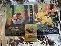 Gold foil Charizard-themed trading card storage pack labeled 'Foil PokeCard'
