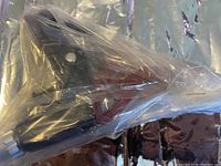 BMX handlebar brake with lever and mounting components inside plastic bag