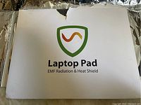 Front of SYB Laptop Pad box with logo and product name.