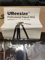 Instruction sheet showing UBeeSize Professional Tripod TR50 with contact email.