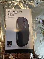 Front view of the product box showing the image of a black rechargeable wireless mouse with label and lighting icon.