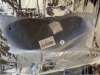 Black unisex outdoor slippers in size 40/41 sealed in original clear plastic packaging, placed on reflective surface