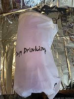 Water bottle inside the branded white fabric protective case with 'Enjoy Drinking' text, shown from the front.