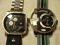 Two Diesel watches side by side, showing metal bracelet and fabric band watches.