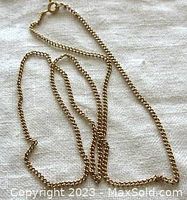 Full 19.5" chain laid out on neutral fabric showing overall length and condition
