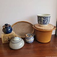 Front view of all 7 pottery pieces showing variety and details of each item.