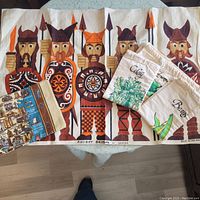 Vintage linen tea towel with Viking warriors and three small linen produce bags