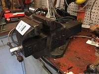 Side view of Jet 6-inch R6 bench vise showing rough condition and mounting on bench.