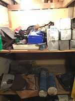 Top shelf showing mixed fittings, blue bins and stacked hermetically sealed Air Liquide electrode cans