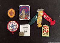 Vintage Boy Scout patches from Old Colony Council from 1974 and 1975, with a red Webelos neckerchief and small scout-related patches.