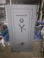Front view of closed Winchester safe showing brand logo and keypad lock