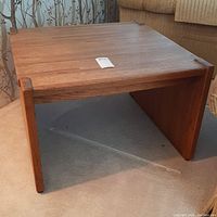 Front and side angle of the solid oak wood end table showing natural wood finish and design.