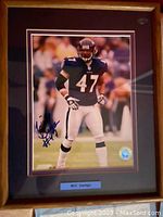 Full front view of the matted and framed, autographed 8x10 photo of Will Demps in Baltimore Ravens uniform.