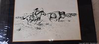 Photo showing a detailed ink drawing of a Native American rider on horse chasing a buffalo in open plains with herd in background.