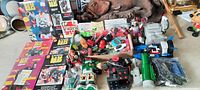 Overview photo displaying the entire assortment of vintage toys including boxed items, loose figures, and accessories.