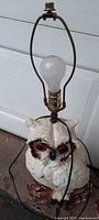 Single owl chalkware lamp with metal harp and bulb. No shade, power cord attached.