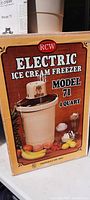 Original box of RCW Electric Ice Cream Freezer Model 71, 4 quart size with vintage graphics and text