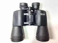 Front view of Bushnell 20x50 Power View binoculars showing the dual eyepieces and central focusing knob.