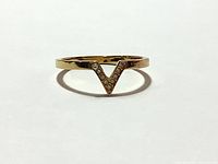 Clear top-down view of the Swarovski V shape ring showing the crystal detail and gold tone metal band.