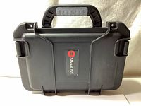 Front view of black Simmons branded hard case with handle.