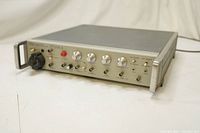 Front panel of UTA-3 ultrasonic transducer analyzer showing analog meter, control knobs, input connectors, switches, and indicator lights.