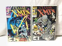 Front view of two Marvel Classic X-Men comic books from 1988, June and July issues, side by side showing cover artwork.