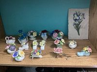 Full view of floral china figurines on shelf