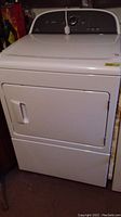 Front view of the white Whirlpool Cabrio dryer showing door and general shape