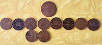 Overview photo showing all eleven Canadian pennies with dates visible including 1917, 1920, 1928, 1929 (two coins), 1932 (two coins), 1933, 1934, 1935, 1936.