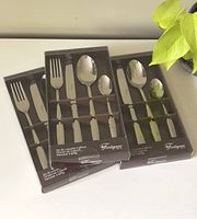 Three new boxed packages of Fontignac 4-piece dinner sets including fork, knife, large spoon, and small spoon