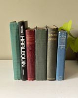 Front view of the 6 vintage hardcover books showing the spines with titles and authors.