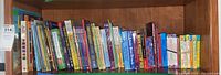Shelf of children's books including Bible Stories, Dr. Seuss, Richard Scarry, Sandra Boynton, Eric Carle, My First I Can Read book set, Joyce Meyer