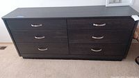 Full front view of dresser showing six drawers and overall style
