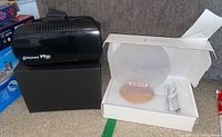 Odyssey VR 3D headset and Glow Disc nightlight laid out with box and USB cable visible